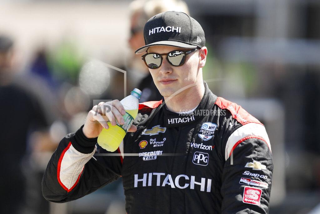 Charlie Neibergall Josef Newgarden walks through the garage area following practice for the IndyCar Series auto race Friday, July 19, 2019, at Iowa Speedway in Newton, Iowa. (AP Photo/Charlie Neibergall)