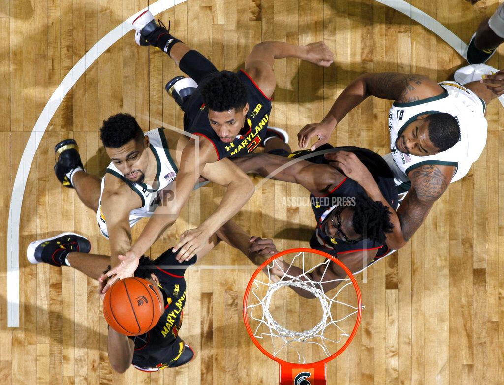 Al Goldis Clockwise from bottom left, Maryland's Ricky Lindo Jr., Michigan State's Kenny Goins, Maryland's Aaron Wiggins and Jalen Smith and Michigan State's Nick Ward vie for a rebound during the second half of an NCAA college basketball game, Monday, Jan. 21, 2019, in East Lansing, Mich. Michigan State won 69-55. (AP Photo/Al Goldis)