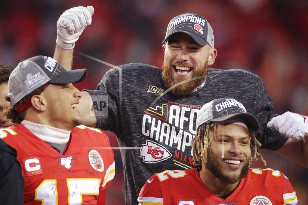 Charlie Riedel Kansas City Chiefs' Travis Kelce Patrick Mahomes and Tyrann Mathieu celebrate after the NFL AFC Championship football game against the Tennessee Titans Sunday, Jan. 19, 2020, in Kansas City, MO. The Chiefs won 35-24 to advance to Super Bowl 54. (AP Photo/Charlie Riedel)