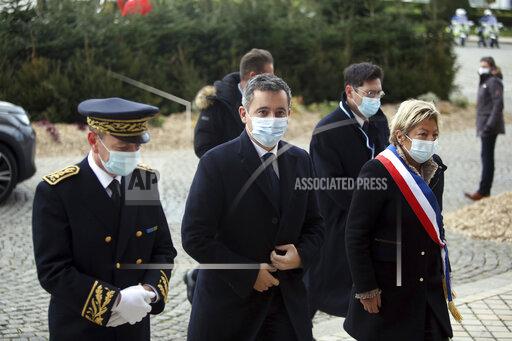 Interior Minister Gerald Darmanin, center, arrives for a meeting with European migration officials, in Calais, northern France, Sunday, Nov. 28, 2021. Top European migration officials are holding an emergency meeting Sunday in the French port of Calais to find ways to better fight migrant smuggling, after 27 people died trying to cross the English Channel to Britain in an overcrowded inflatable boat. (AP Photo/Rafael Yaghobzadeh)