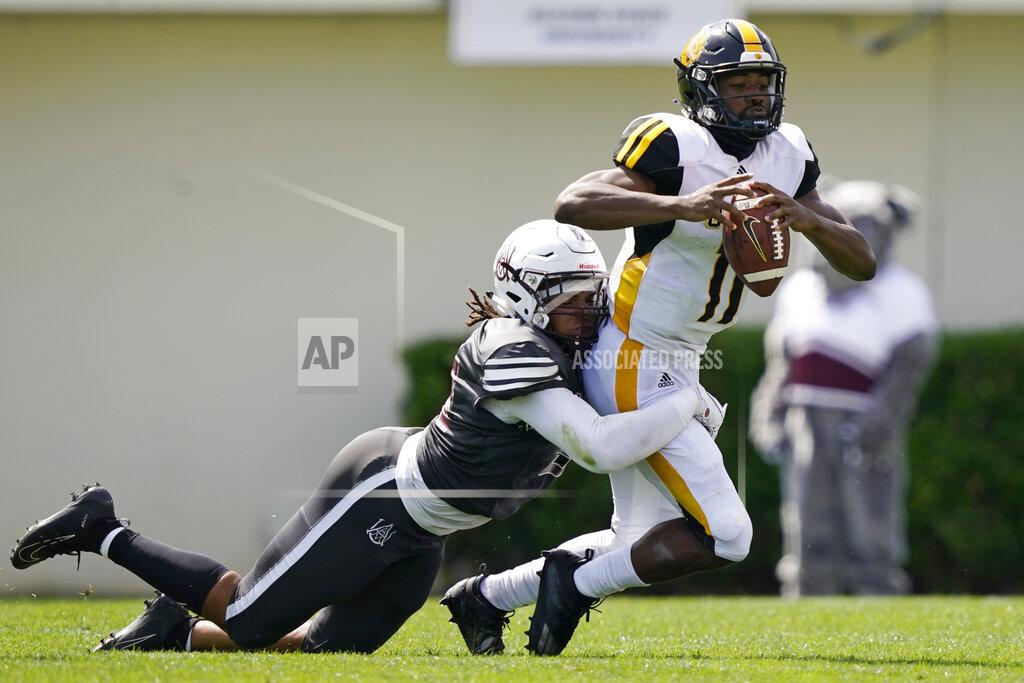 Rogelio V. Solis Arkansas-Pine Bluff quarterback Skyler Perry (11) is sacked by Alabama A&M defensive end Marcus Cushnie during the first half of the Southwestern Athletic Conference championship NCAA college football game Saturday, May 1, 2021, in Jackson, Miss. (AP Photo/Rogelio V. Solis)