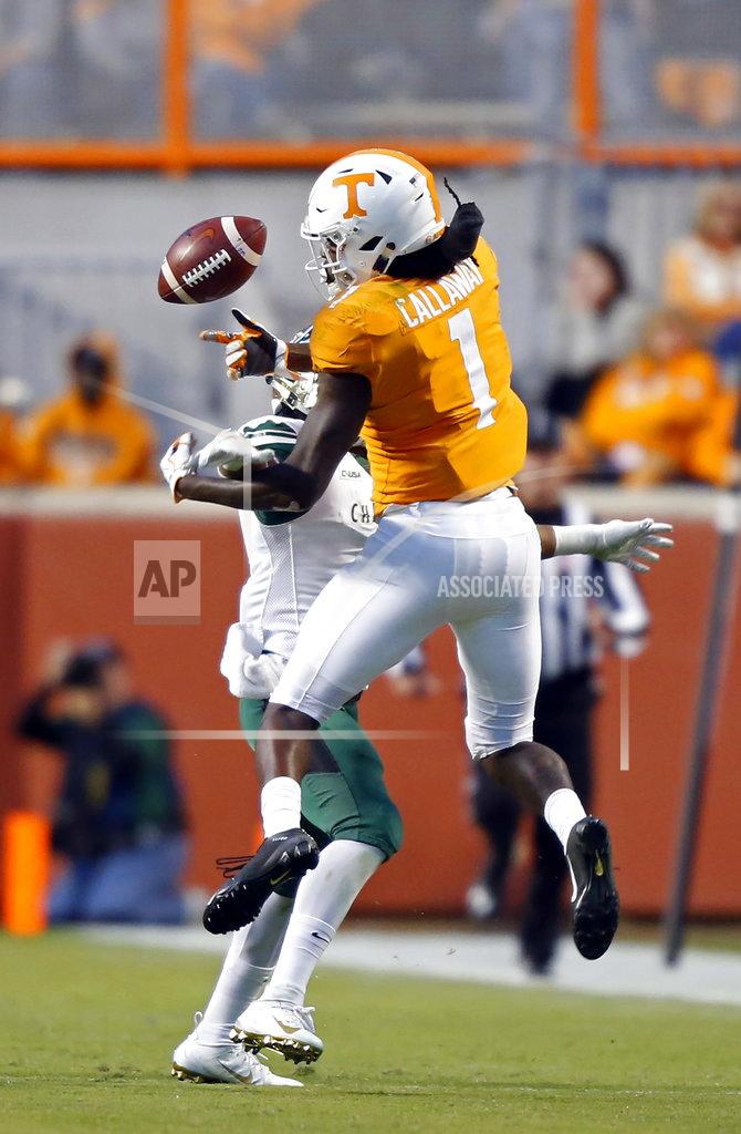 Wade Payne Tennessee wide receiver Marquez Callaway (1) loses control of the ball as he's hit by a Charlotte defender in the second half of an NCAA college football game Saturday, Nov. 3, 2018, in Knoxville, Tenn. Tennessee won 14-3. (AP Photo/Wade Payne)