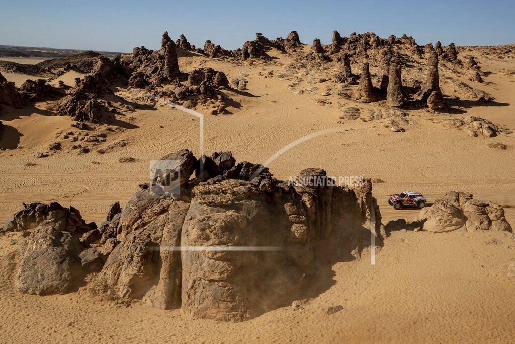 Bernat Armangue Driver Stephane Peterhansel, of France, and co-driver Paulo Fiuza, of Portugal, race their Mini during stage four of the Dakar Rally between Neom and Al Ula, in Saudi Arabia, Wednesday, Jan. 8, 2020. (AP Photo/Bernat Armangue)