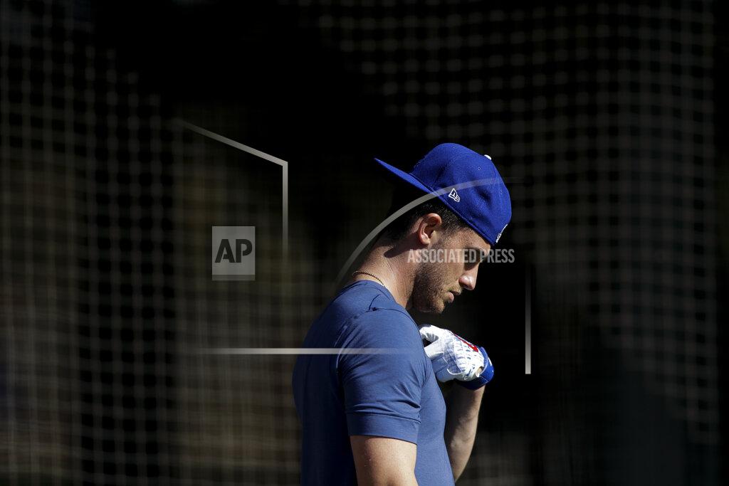 Los Angeles Dodgers center fielder Cody Bellinger leaves the batting cages during spring training baseball Friday, Feb. 14, 2020, in Phoenix. (AP Photo/Gregory Bull)