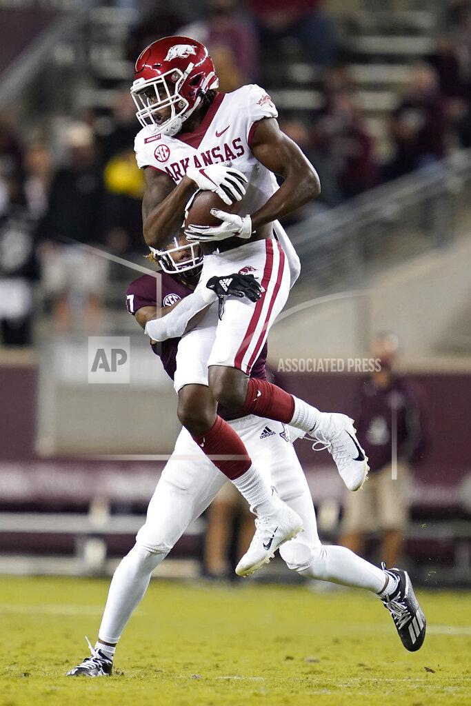 Sam Craft Arkansas wide receiver Mike Woods, top, catches a pass against Texas A&M defensive back Jaylon Jones (17) during the second quarter of an NCAA college football game, Saturday, Oct. 31, 2020, in College Station, Texas. (AP Photo/Sam Craft)