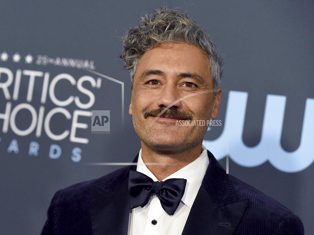 Jordan Strauss FILE - Taika Waititi arrives at the 25th annual Critics' Choice Awards on Jan. 12, 2020, in Santa Monica, Calif. Waititi is among the entertainers who took the initiative to make the best out of a challenging year. The filmmaker led a celebrity read-along of Roald Dahl's novel "James and the Giant Peach," to raise money for Partners in Health, a medical and social justice organization fighting COVID-19 and supporting public health systems in vulnerable areas around the world. (Photo by Jordan Strauss/Invision/AP, File)