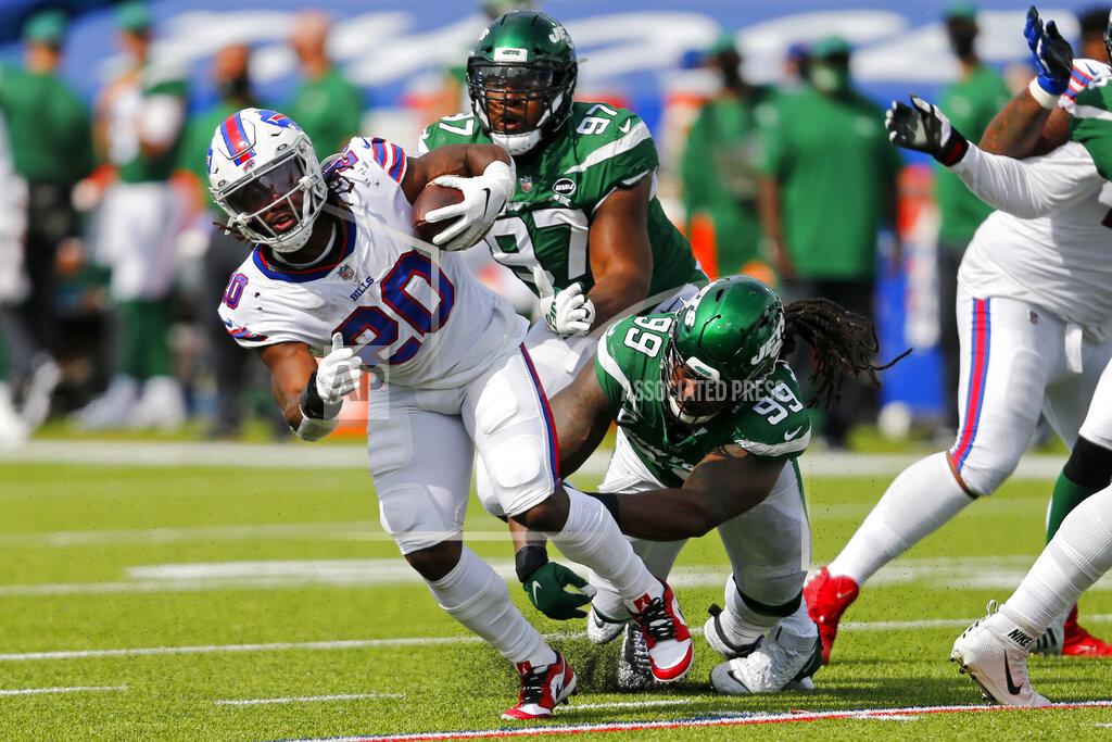Jeffrey T. Barnes Buffalo Bills running back Zack Moss (20) is tackled by New York Jets nose tackle Steve McLendon (99) during the second half of an NFL football game in Orchard Park, N.Y., Sunday, Sept. 13, 2020. (AP Photo/Jeffrey T. Barnes)