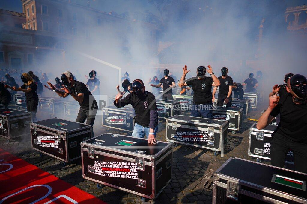Andrew Medichini Entertainment workers gather in Piazza del Popolo Square to protest against the Italian government's economic policies to combat the spread of COVID-19 and to demand to reopen their business, in Rome, Saturday, April 17, 2021. (AP Photo/Andrew Medichini)