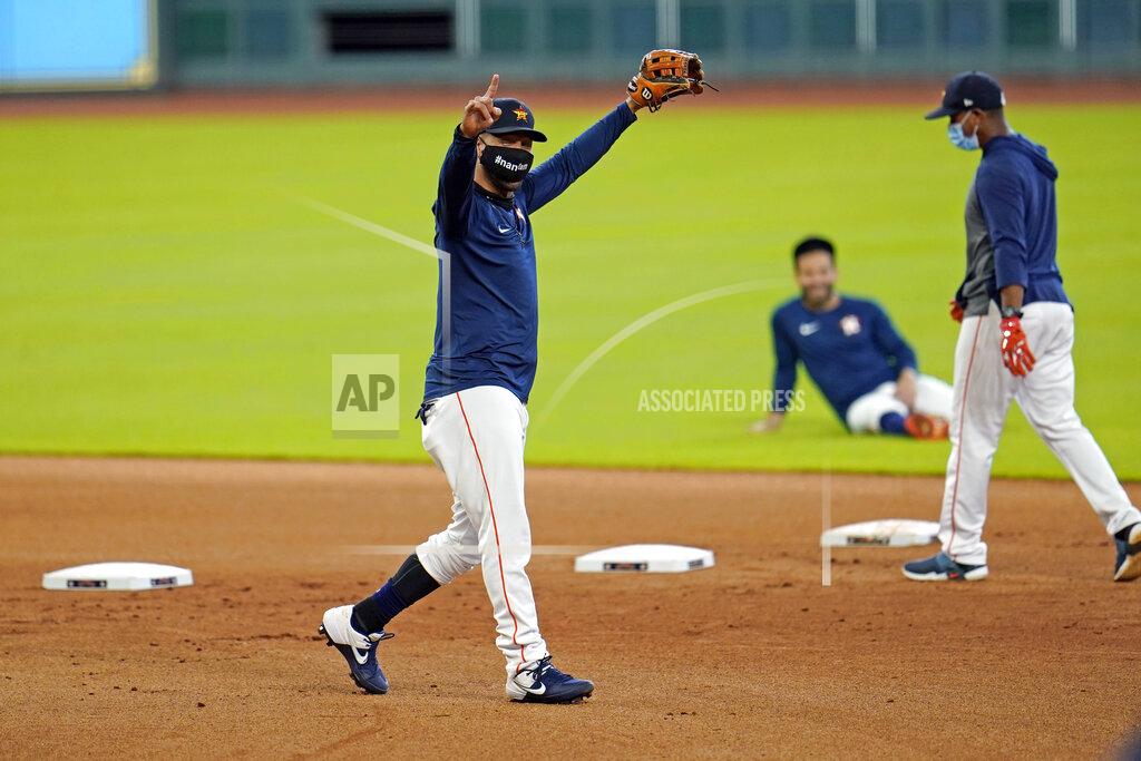 David J. Phillip Houston Astros first baseman Yuli Gurriel reacts after completing a drill during a baseball practice at Minute Maid Park, Sunday, July 5, 2020, in Houston. (AP Photo/David J. Phillip)