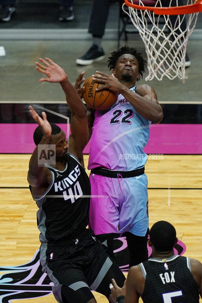 Marta Lavandier Sacramento Kings forward Harrison Barnes (40) fouls Miami Heat forward Jimmy Butler (22) as he drives to the basket during the second half of an NBA basketball game, Saturday, Jan. 30, 2021, in Miami. (AP Photo/Marta Lavandier)