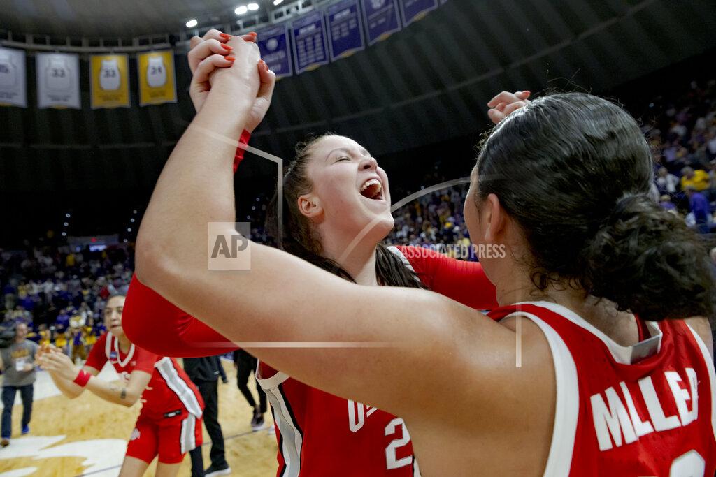 Matthew Hinton Ohio State forward Rebeka Mikulasikova, left, and guard Braxtin Miller celebrate their victory over LSU in a women's college basketball game in the second round of the NCAA tournament, Monday, March 21, 2022, in Baton Rouge, La. (AP Photo/Matthew Hinton)