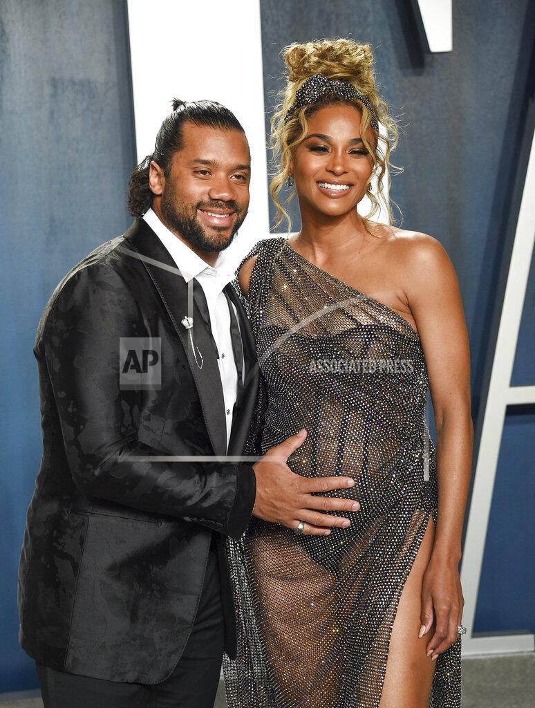 Evan Agostini FILE - NFL quarterback Russell Wilson, left, and his pregnant wife Ciara arrive at the Vanity Fair Oscar Party in Beverly Hills, Calif. on Feb. 9, 2020. Wilson and his pop star wife Ciara are now parents to a baby boy. The couple announced Friday the birth of their son named Win Harrison Wilson on Instagram. (Photo by Evan Agostini/Invision/AP, File)