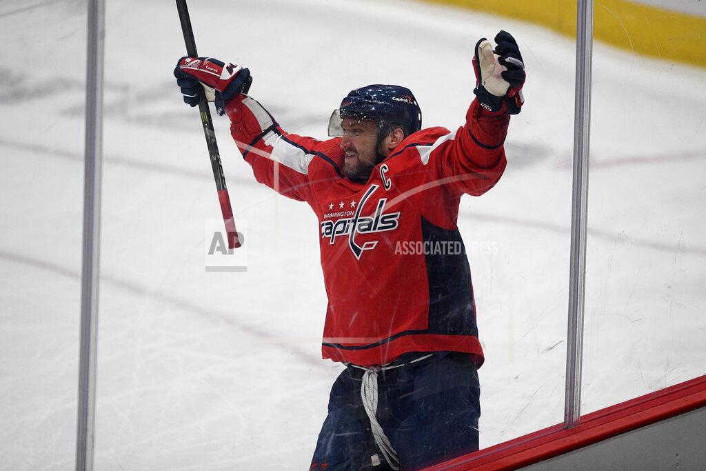 Nick Wass Washington Capitals left wing Alex Ovechkin (8), of Russia, celebrates his game-winning goal in overtime of an NHL hockey game against the Boston Bruins, Saturday, Jan. 30, 2021, in Washington. The Capitals won 4-3 in overtime. (AP Photo/Nick Wass)