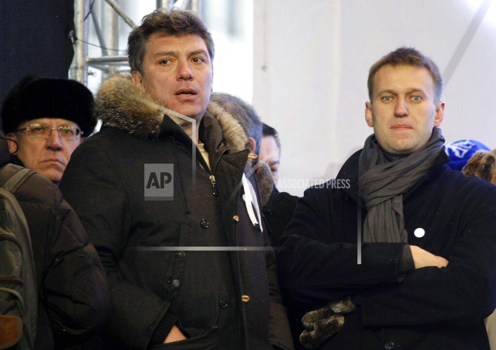 Misha Japaridze FILE - In this Dec. 24, 2011, file photo, from left, Russian former Financial Minister Alexei Kudrin, leaders of the opposition Boris Nemtsov and Alexei Navalny attend a rally to protest alleged vote rigging in Russia's parliamentary elections on Sakharov avenue in Moscow, Russia. Navalny is an anti-corruption campaigner and the Kremlin’s fiercest critic. He has outlasted many opposition figures and is undeterred by incessant attempts to stop his work. (AP Photo/Misha Japaridze, File)