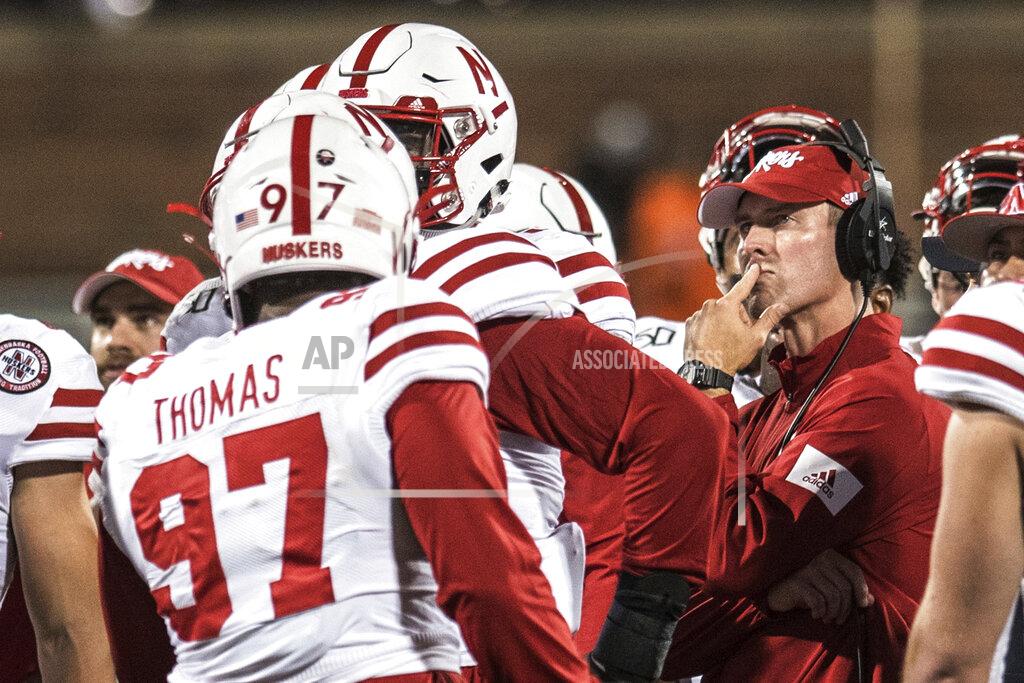 Holly Hart Nebraska head coach Scott Frost stands with his team during a timeout in the first half of an NCAA college football game against Illinois, Saturday, Sept. 21, 2019, in Champaign, Ill. (AP Photo/Holly Hart)