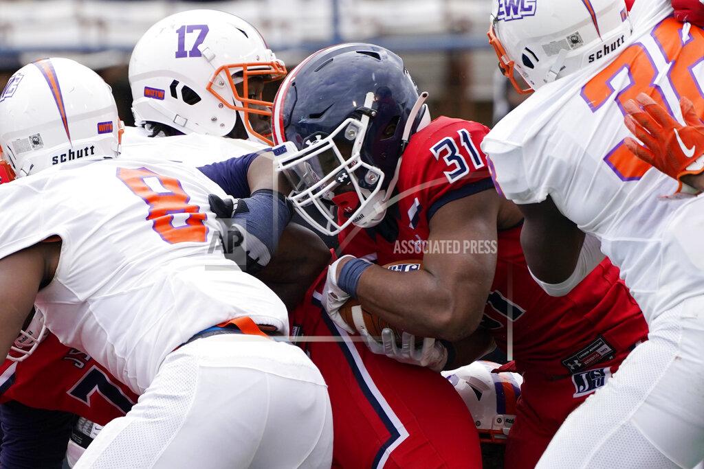 Rogelio V. Solis Jackson State running back Greg Williams (31) scores a touchdown on a short run against Edward Waters defenders including defensive back Cameron McClain (8) during the second half of an NCAA college football game in Jackson, Miss., Sunday, Feb. 21, 2021. Jackson State won the game, which was also the college coaching debut of Jackson State head coach Deion Sanders. (AP Photo/Rogelio V. Solis)