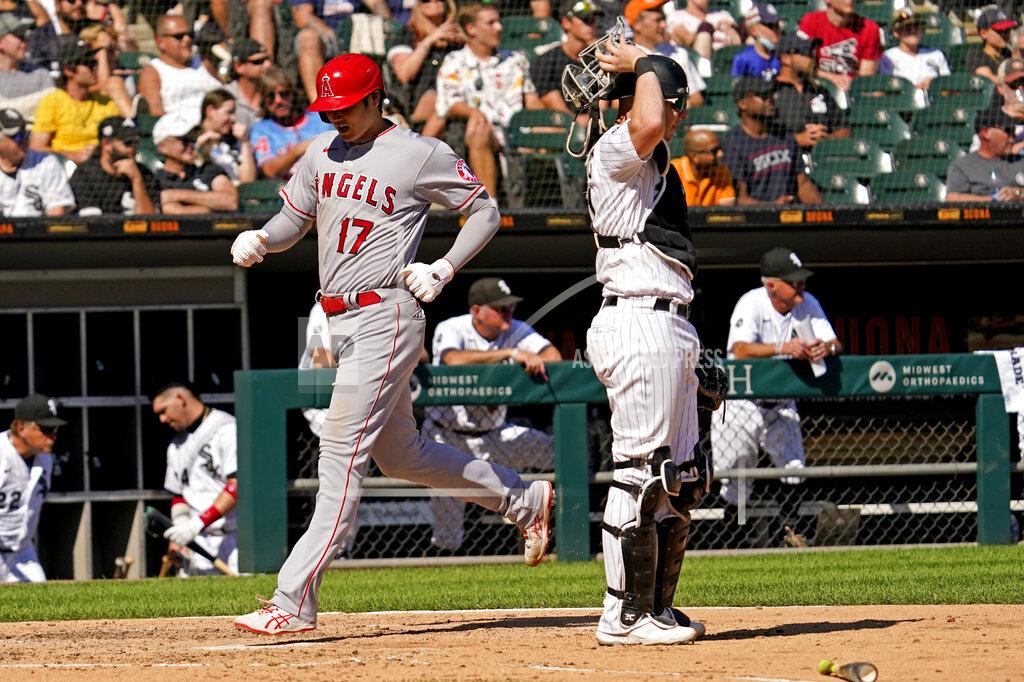 Nam Y. Huh Los Angeles Angels' Shohei Ohtani, of Japan, left, scores on a one-run single by Jared Walsh as Chicago White Sox catcher Zack Collins looks to the field during the fifth inning of a baseball game in Chicago, Thursday, Sept. 16, 2021. (AP Photo/Nam Y. Huh)