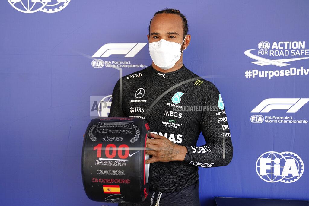 Emilio Morenatti Mercedes driver Lewis Hamilton of Britain poses after he clocked the fastest time in the qualifying for the Spanish Formula One Grand Prix at the Barcelona Catalunya racetrack in Montmelo, just outside Barcelona, Spain, Saturday, May 8, 2021. The Spanish Grand Prix will be held on Sunday. (AP Photo/Emilio Morenatti, Pool)