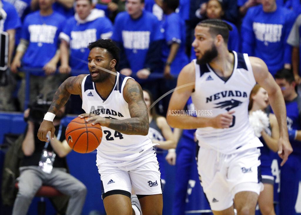 David Zalubowski Nevada forward Jordan Caroline, back, picks up a loose ball and trails forward Caleb Martin down the court against Air Force during the first half of an NCAA college basketball game Tuesday, March 5, 2019, at Air force Academy, Colo.(AP Photo/David Zalubowski)
