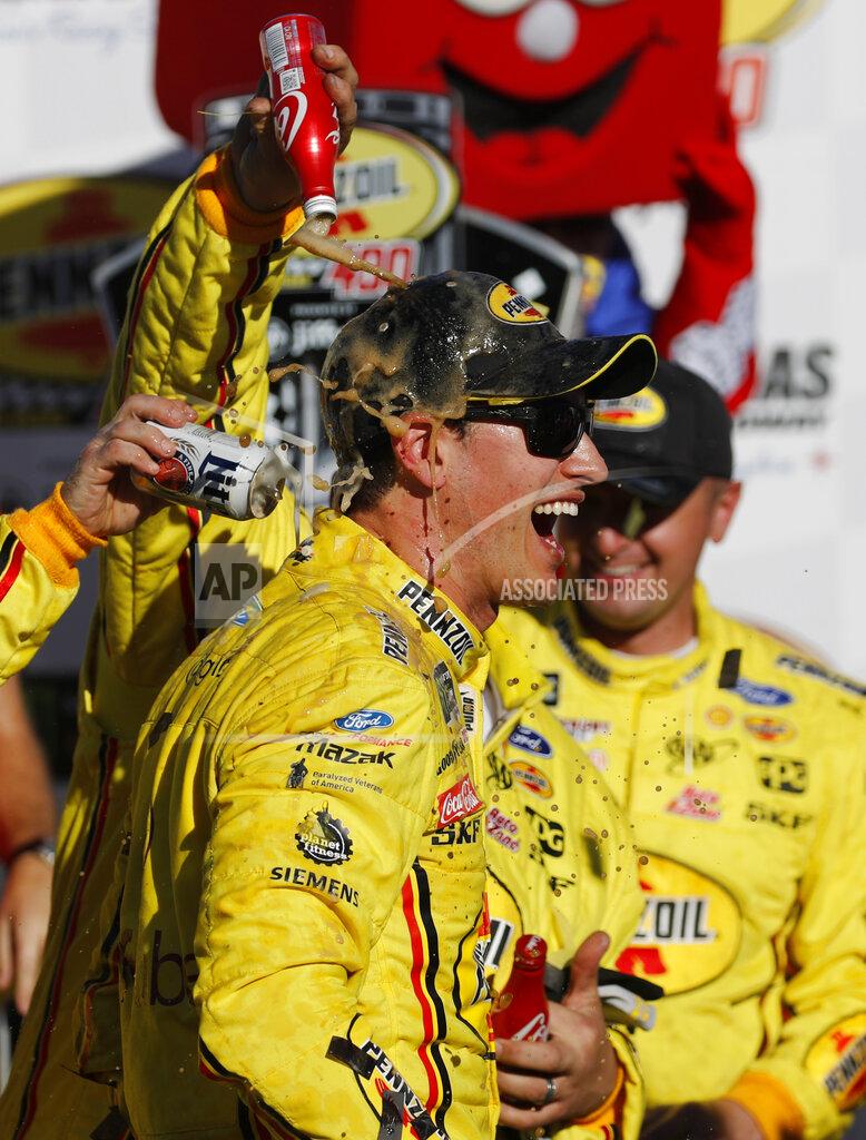 John Locher Joey Logano celebrates after winning a NASCAR Cup Series auto race at Las Vegas Motor Speedway, Sunday, March 3, 2019, in Las Vegas. (AP Photo/John Locher)