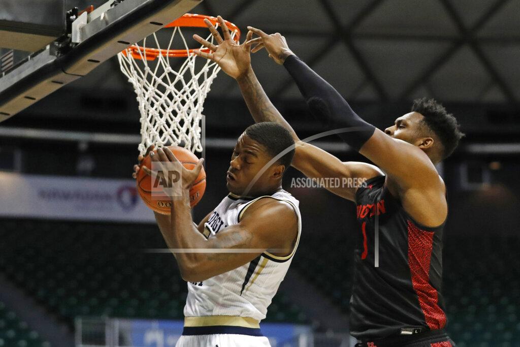 Marco Garcia Georgia Tech forward Moses Wright (5) grabs a rebound away from Houston center Chris Harris Jr. (1) during the first half of an NCAA college basketball game Monday, Dec. 23, 2019, in Honolulu. (AP Photo/Marco Garcia)