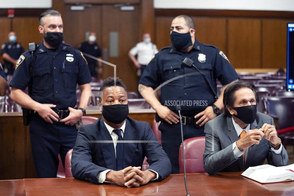 Steven Hirsch FILE - In this Aug. 13, 2020 file photo, Cuba Gooding Jr., front left, sits at the defense table with his lawyer Marc Heller, during a hearing in his sexual misconduct case in New York. U.S. District Judge Paul Crotty issued a default judgment against Gooding on Thursday, July 29, 2021, saying it appeared the Oscar-winning "Jerry Maguire" star was willfully ignoring the lawsuit and that waiting for him any longer would be unfair to his accuser. Crotty said that under the law, the 53-year-old Gooding's failure to respond and defend himself in the lawsuit constituted an admission of liability. (Steven Hirsch/New York Post via AP, Pool, File)