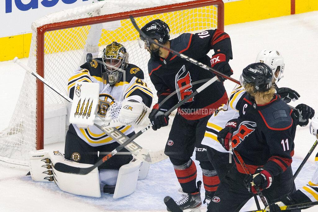 Chris Young Boston Bruins goaltender Jaroslav Halak (41) eyes the puck in front of Carolina Hurricanes' Vincent Trocheck (16) as Hurricanes' Jordan Staal (11) looks on during third period NHL Eastern Conference Stanley Cup playoff game in Toronto on Saturday, Aug. 15, 2020. (Chris Young/The Canadian Press via AP)