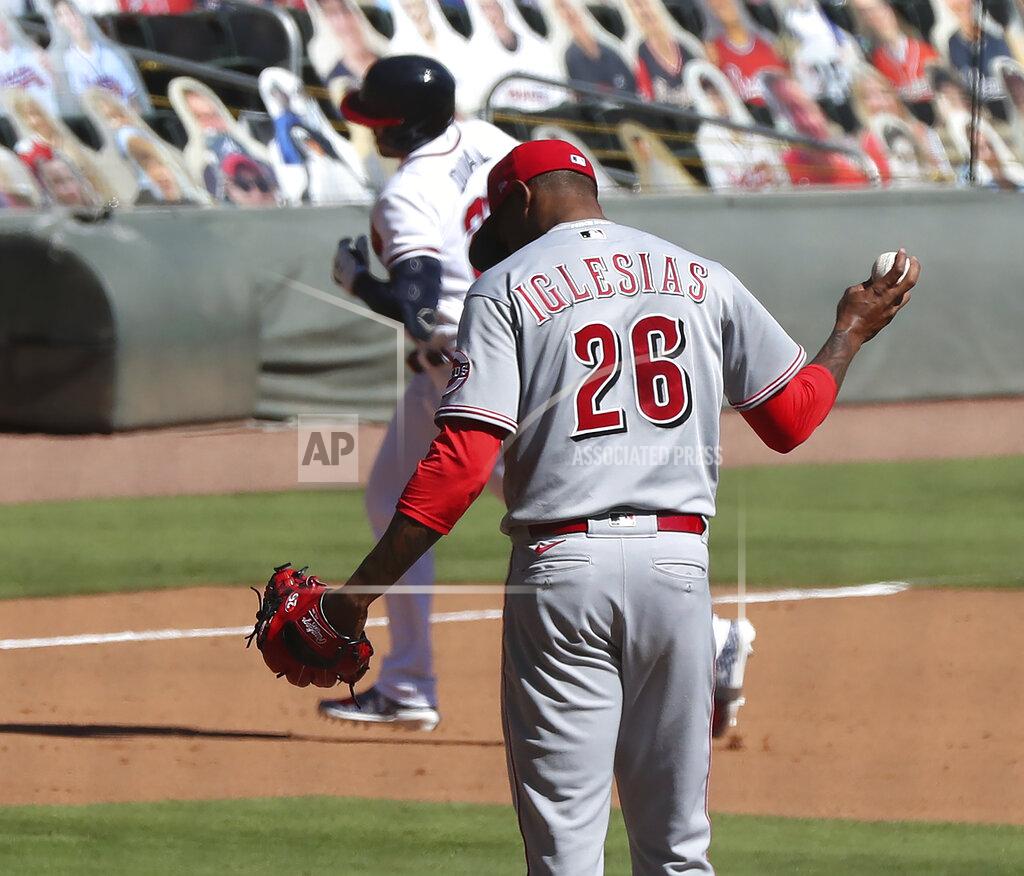 Curtis Compton Cincinnati Reds pitcher Raisel Iglesias reacts as Atlanta Braves' Adam Duvall rounds the bases after hitting a two-run home run in the eighth inning in Game 2 of a National League wild-card baseball series, Thursday, Oct. 1, 2020, in Atlanta. (Curtis Compton/Atlanta Journal-Constitution via AP)