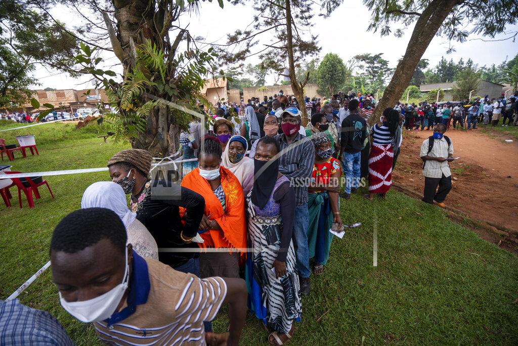 Jerome Delay Ugandans wait to vote in Kampala, Uganda, Thursday, Jan. 14, 2021. Ugandans are voting in a presidential election tainted by widespread violence that some fear could escalate as security forces try to stop supporters of leading opposition challenger BobiWine from monitoring polling stations.(AP Photo/Jerome Delay)