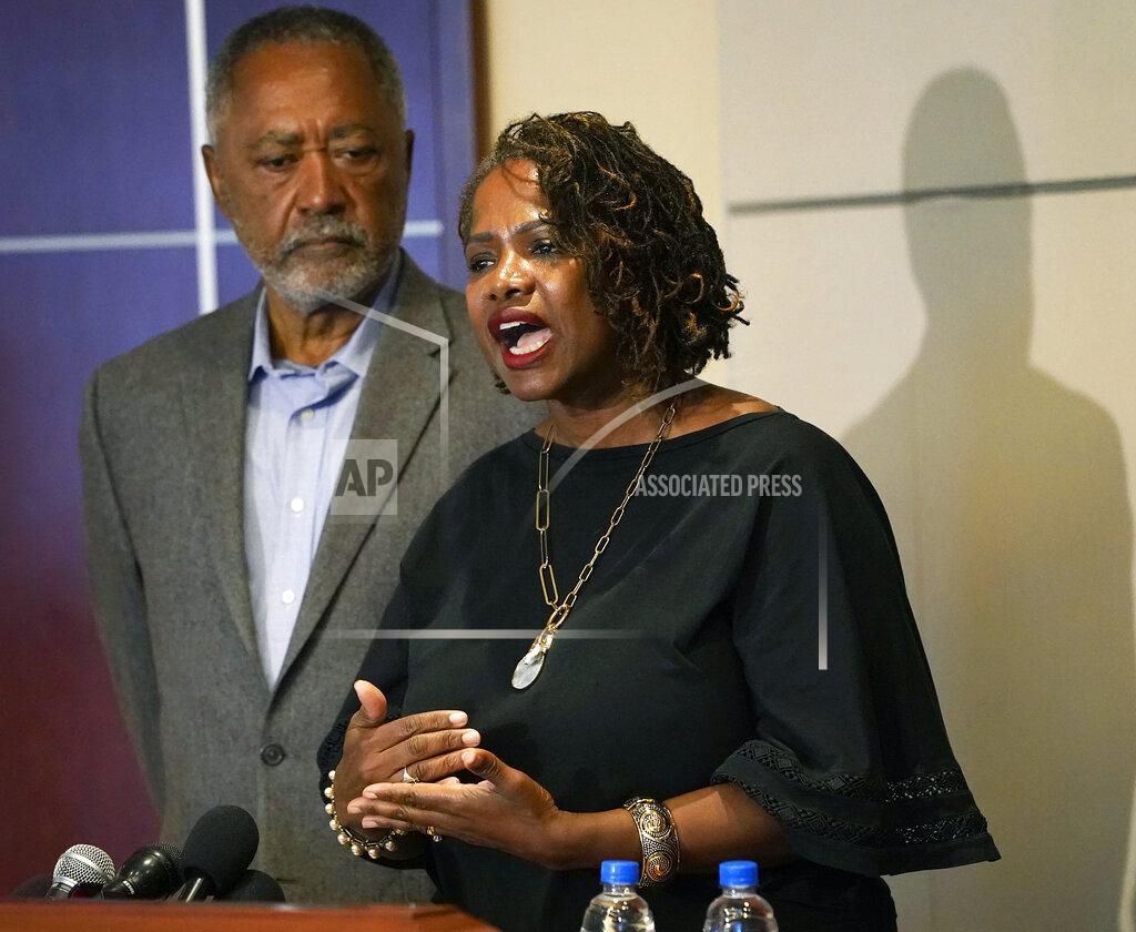 David Joles Minneapolis resident and former City Council Member Don Samuels listens as his wife Sondra speaks during a news conference at their attorney's office to discuss where the situation stands regarding language on the future of the Minneapolis policing ballot Wednesday, Sept. 15, 2021, in Minneapolis. A judge struck down ballot language last week that aimed to replace the Minneapolis Police Department with a new agency, which sent the City Council scrambling to approve new language that members hope will stand up. The injunction to keep the language off the ballot was sought by Samuels, his wife, and businessman Bruce Dachis. (David Joles/Star Tribune via AP)