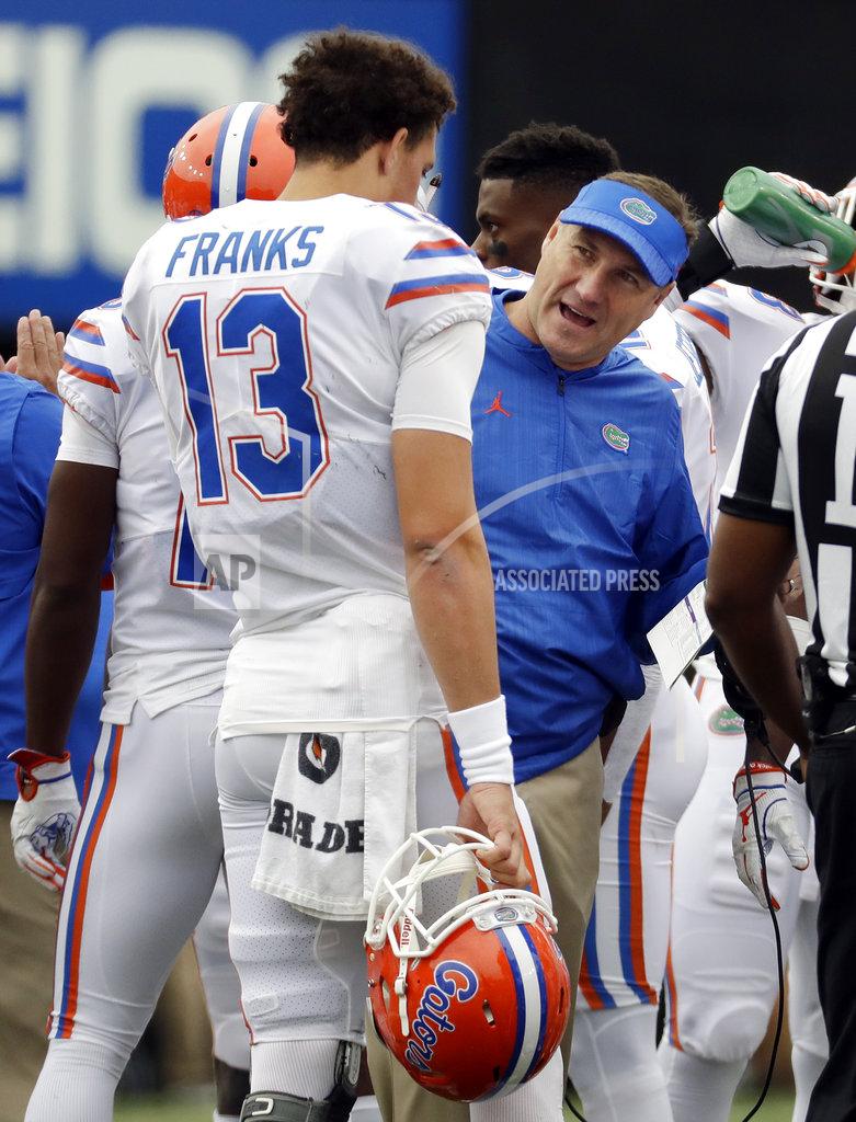 Mark Humphrey Florida head coach Dan Mullen talks with quarterback Feleipe Franks (13) in the first half of an NCAA college football game against Vanderbilt, Saturday, Oct. 13, 2018, in Nashville, Tenn. (AP Photo/Mark Humphrey)