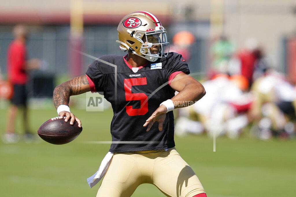 Jeff Chiu San Francisco 49ers quarterback Trey Lance throws a pass at NFL football training camp in Santa Clara, Calif., Tuesday, Aug. 10, 2021. The 49ers are read to show off their shiny new quarterback to the public when rookie Trey Lance gets ready to play in his first exhibition game this weekend. (AP Photo/Jeff Chiu)