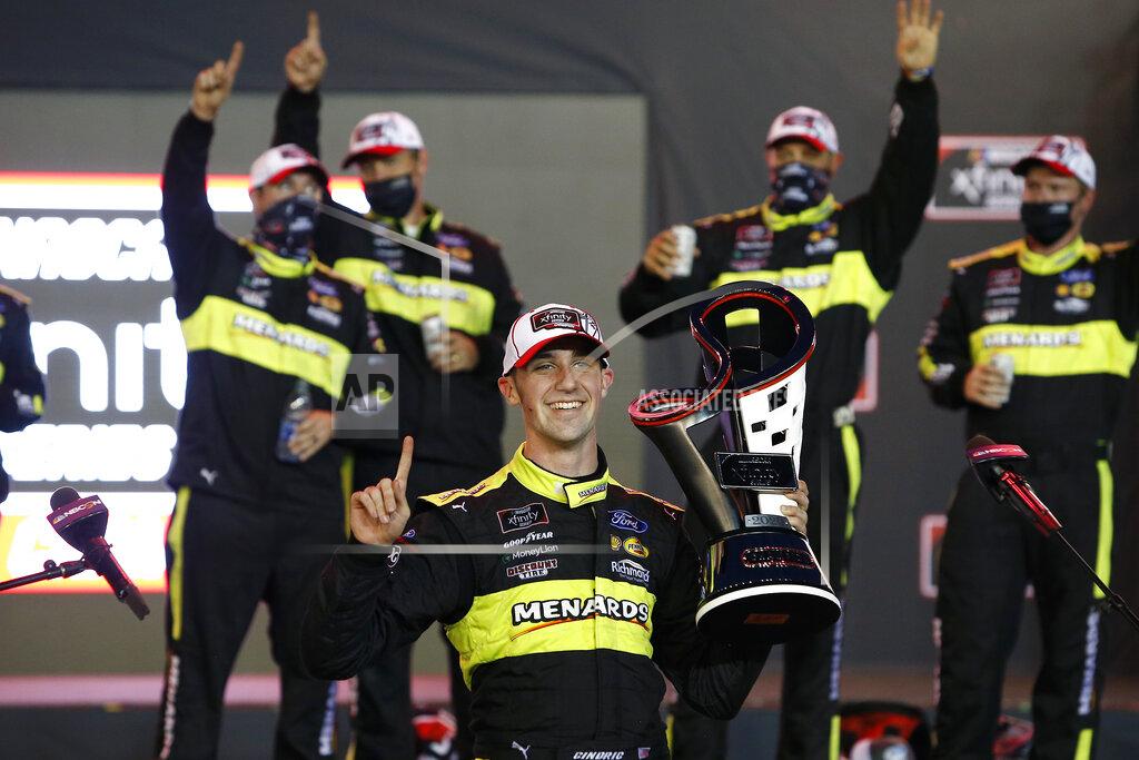 Ralph Freso Austin Cindric holds the season championship trophy in Victory Lane after winning a NASCAR Xfinity Series auto race at Phoenix Raceway, Saturday, Nov. 7, 2020, in Avondale, Ariz. (AP Photo/Ralph Freso)