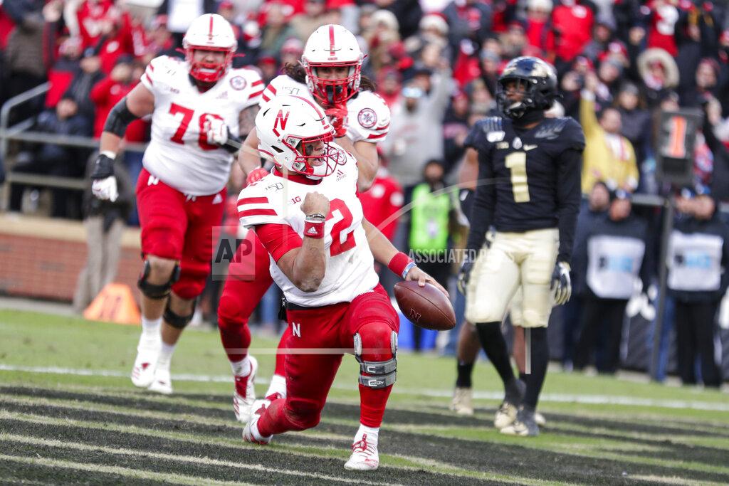 Michael Conroy Nebraska quarterback Adrian Martinez (2) celebrates a touchdown against Purdue during the second half of an NCAA college football game in West Lafayette, Ind., Saturday, Nov. 2, 2019. Purdue defeated Nebraska 31-27. (AP Photo/Michael Conroy)