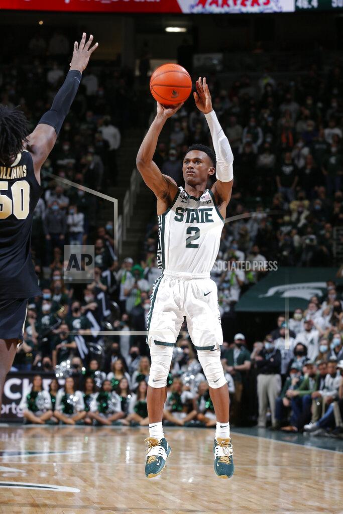 Al Goldis Michigan State's Tyson Walker (2) shoots the game-winning 3-pointer against Purdue's Trevion Williams during the second half of an NCAA college basketball game, Saturday, Feb. 26, 2022, in East Lansing, Mich. Michigan State won 68-65. (AP Photo/Al Goldis)