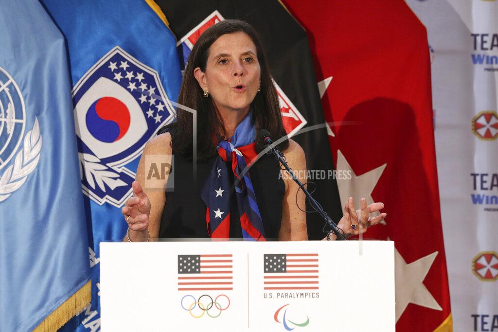 FILE - In this Aug. 1, 2017, file photo, then-U.S. Olympic Committee chief marketing officer Lisa Baird speaks about the Team USA WinterFest for the upcoming 2018 Pyeongchang Winter Olympic Games, at Yongsan Garrison, a U.S. military base in Seoul, South Korea. U.S. Soccer is no longer managing the National Women's Soccer League although some aspects of the partnership remain, NWSL Commissioner Lisa Baird said. Baird spoke Tuesday, Jan. 12,c2021, on a wide-ranging conference call with reporters ahead of the league's draft on Wednesday night.(AP Photo/Lee Jin-man, File)