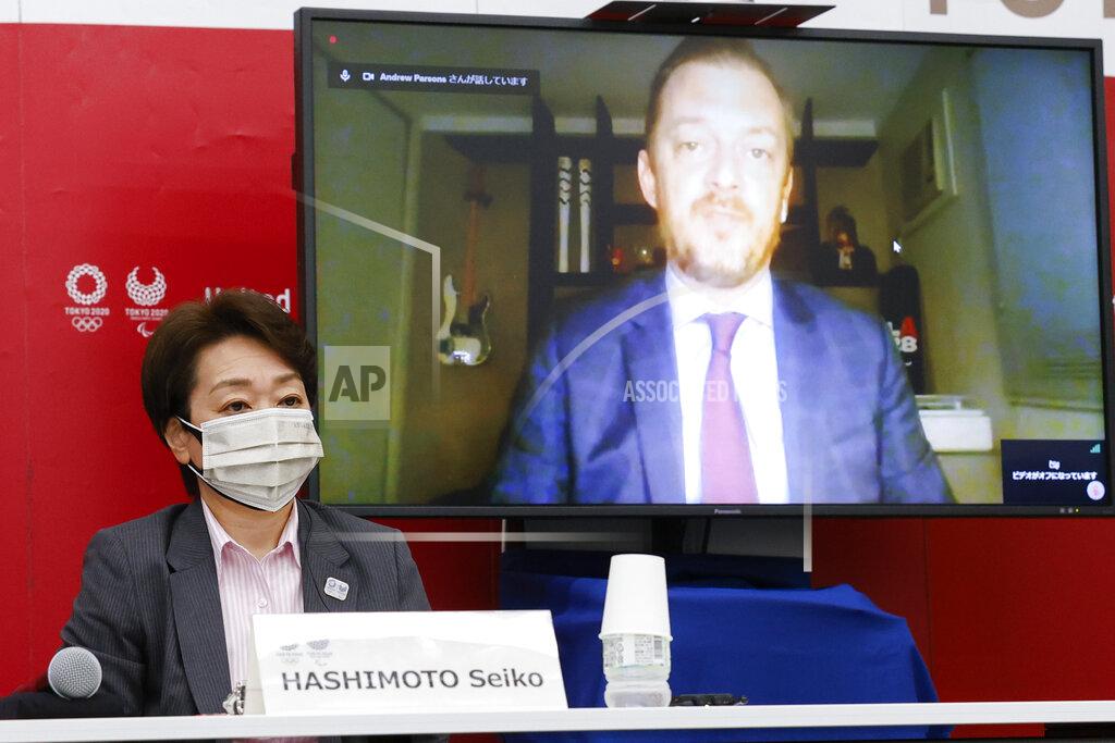 FILE - In this June 21, 2021, file photo, Tokyo 2020 President Seiko Hashimoto listens to International Paralympic Committee (IPC) President Andrew Parson, on a screen, during a five-party online meeting at Harumi Island Triton Square Tower Y in Tokyo. The opening next week of the Paralympic Games in Tokyo is being used as a stage to launch a human rights movement aimed at the world’s 1.2 billion people with disabilities.(Rodrigo Reyes Marin/Pool Photo via AP, File)