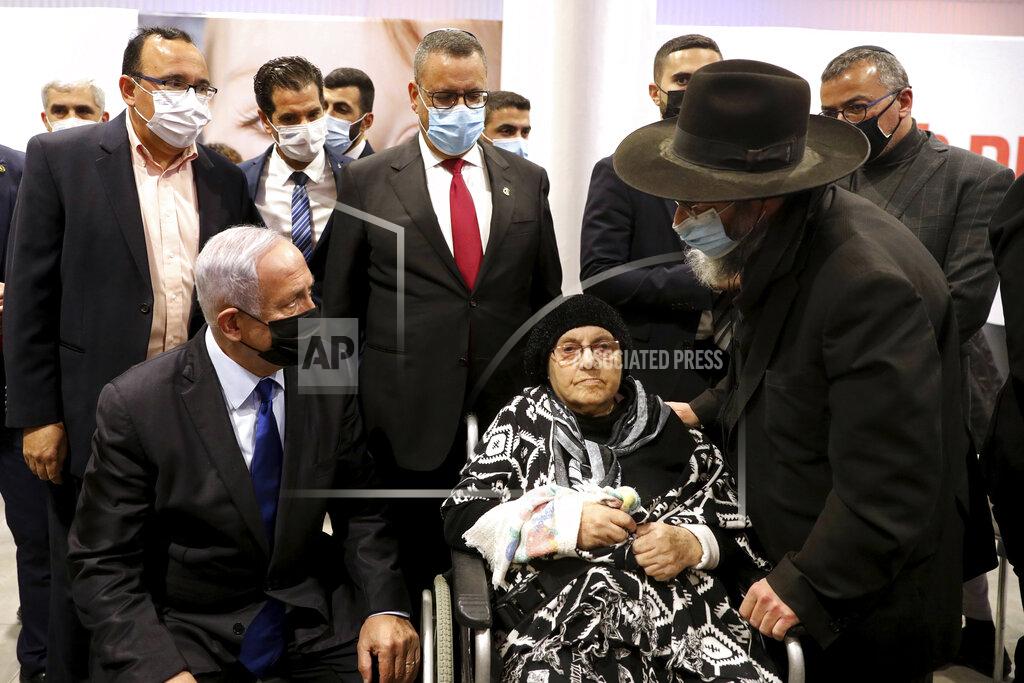 Marc Israel Sellem Israeli Prime Minister Benjamin Netanyahu, left, visits a coronavirus vaccination facility in Jerusalem, Wednesday, Jan. 6, 2021. (Marc Israel Sellem/Pool via AP)