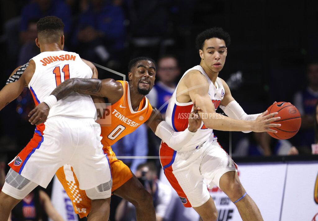 Matt Stamey Tennessee guard Jordan Bone (0) is fouled by Florida forward Keyontae Johnson (11) while guarding Florida guard Andrew Nembhard (2) during the first half of an NCAA college basketball game Saturday, Jan. 12, 2019, in Gainesville, Fla. (AP Photo/Matt Stamey)