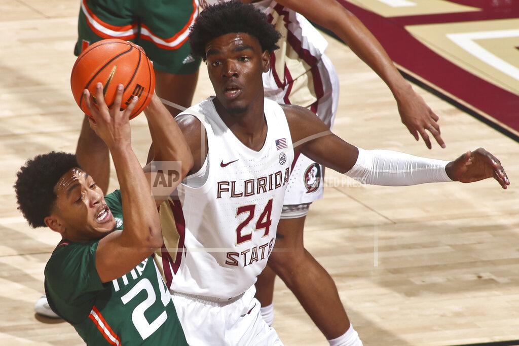 Phil Sears Miami guard Nijel Pack (24) gets a rebound as Florida State center Naheem McLeod (24) looks on in the first half of an NCAA college basketball game in Tallahassee, Fla., Tuesday, Jan. 24, 2023. (AP Photo/Phil Sears)