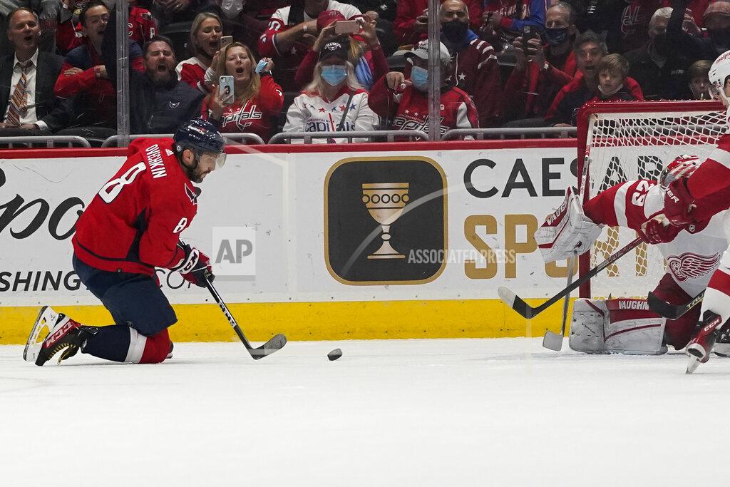 Alex Brandon Washington Capitals left wing Alex Ovechkin (8) prepares to score from his knees past Detroit Red Wings goaltender Thomas Greiss (29) in the first period of an NHL hockey game, Wednesday, Oct. 27, 2021, in Washington. (AP Photo/Alex Brandon)