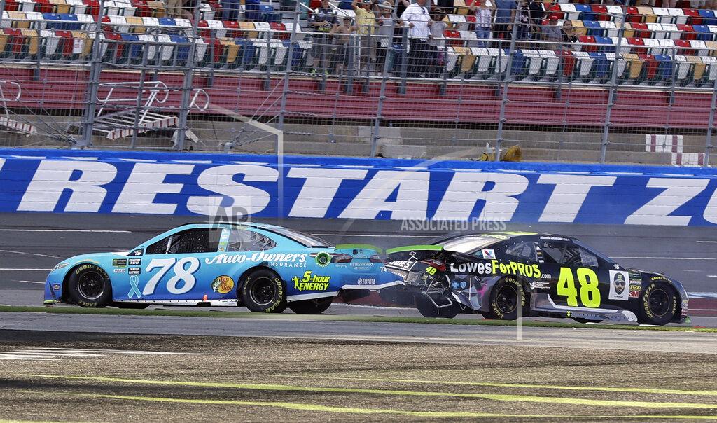 Chuck Burton FILE - In this Sept. 30, 2018, file photo, Martin Truex Jr., (78) and Jimmie Johnson (48) crash on the final lap during the NASCAR Cup series auto race at Charlotte Motor Speedway in Concord, N.C. Charlotte Motor Speedway will host the Coca-Cola 600 on May 24, 2020, to mark 60 consecutive years the longest race on the NASCAR schedule will be held on Memorial Day weekend. The track in Concord will then host a Wednesday race three days later. (AP Photo/Chuck Burton, File)