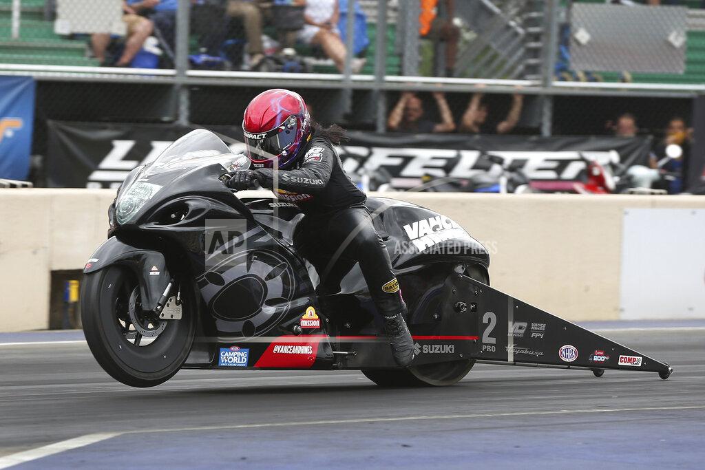 Bob Szelag In this photo provided by the NHRA, Pro Stock Motorcycle's Angelle Sampey rides to her first win of the season in the final round at Summit Racing Equipment Motorsports Park at the Summit Racing Equipment NHRA Nationals in Norwalk, Ohio, Sunday, June 26, 2022. (Bob Szelag/NHRA via AP)