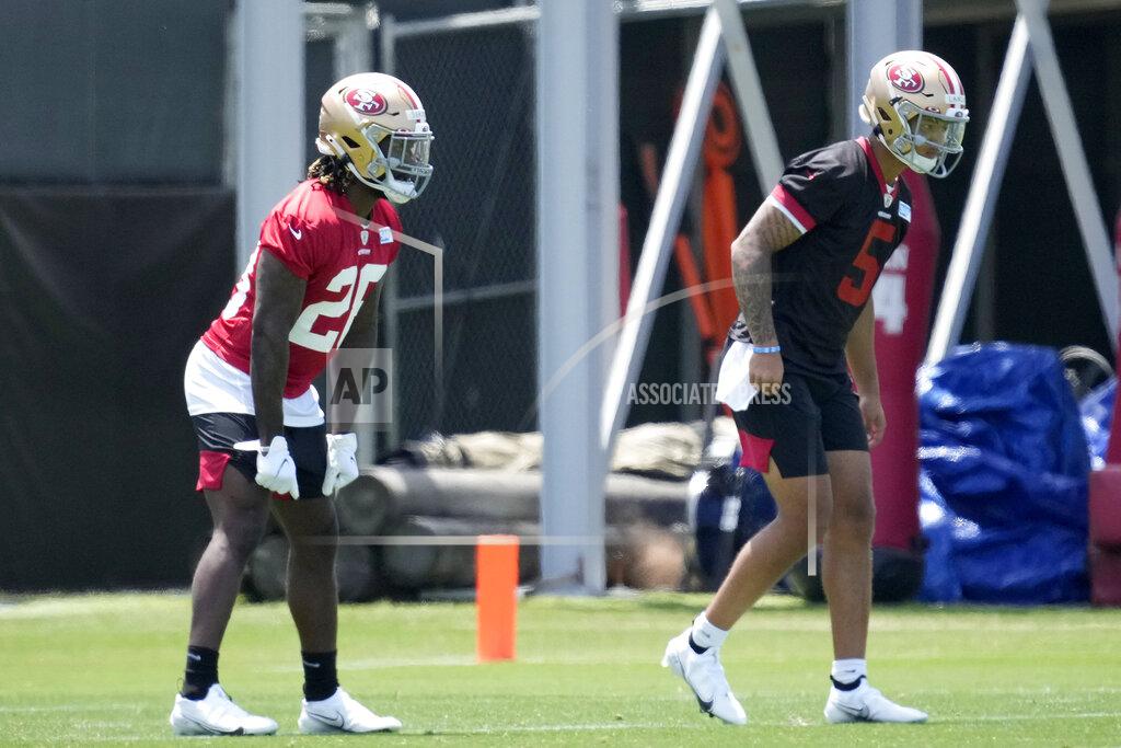 Tony Avelar San Francisco 49ers rookie quarterback Trey Lance, right, and running back Trey Sermon, left, run drills during NFL football rookie minicamp in Santa Clara, Calif., Friday, May 14, 2021. (AP Photo/Tony Avelar)