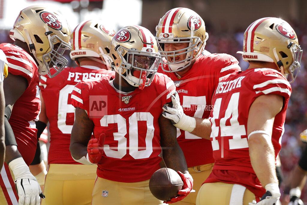 Ben Margot San Francisco 49ers running back Jeff Wilson Jr. (30) celebrates with teammates after scoring against the Pittsburgh Steelers during the second half of an NFL football game in Santa Clara, Calif., Sunday, Sept. 22, 2019. (AP Photo/Ben Margot)