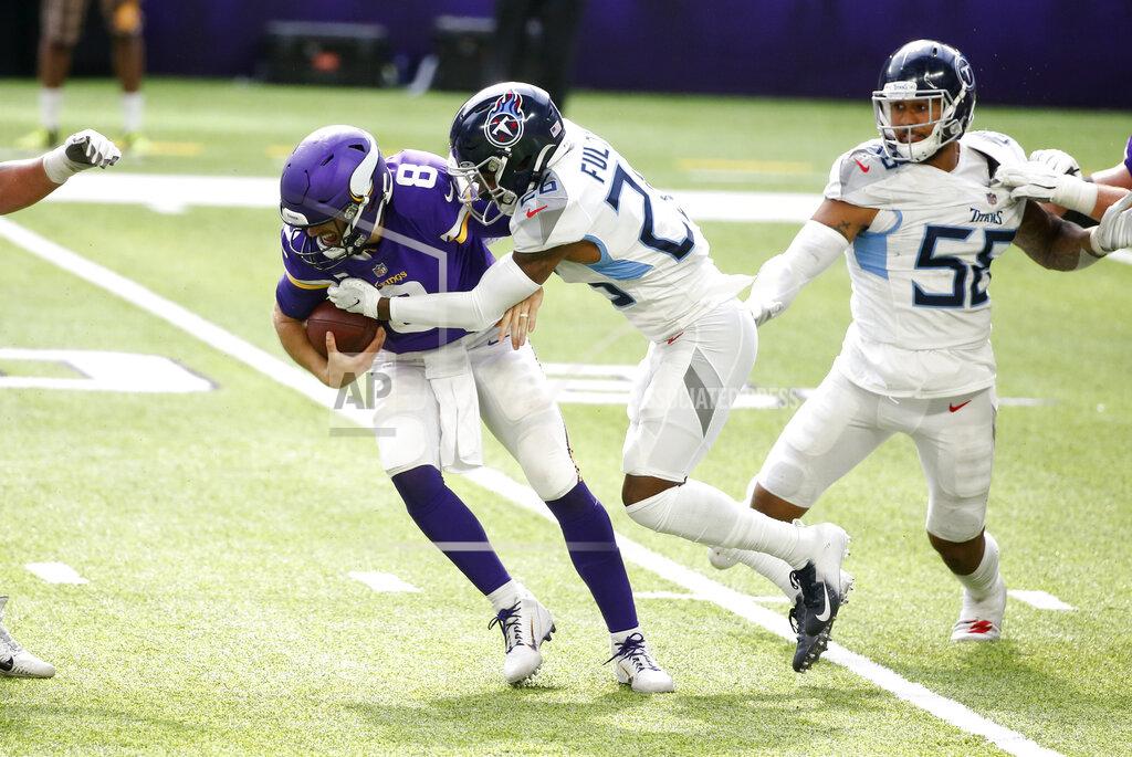 Bruce Kluckhohn Minnesota Vikings quarterback Kirk Cousins (8) is sacked by Tennessee Titans cornerback Kristian Fulton during the second half of an NFL football game, Sunday, Sept. 27, 2020, in Minneapolis. The Titans won 31-30. (AP Photo/Bruce Kluckhohn)
