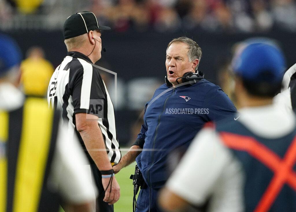 David J. Phillip New England Patriots head coach Bill Belichick, center, questions a call during the first half of an NFL football game Sunday, Dec. 1, 2019, in Houston. (AP Photo/David J. Phillip)