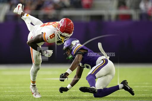 Kansas City Chiefs wide receiver Justyn Ross (8) is tackled by Minnesota Vikings cornerback Mekhi Blackmon (5) after catching a pass during the second half of an NFL football game, Sunday, Oct. 8, 2023, in Minneapolis. (AP Photo/Abbie Parr)