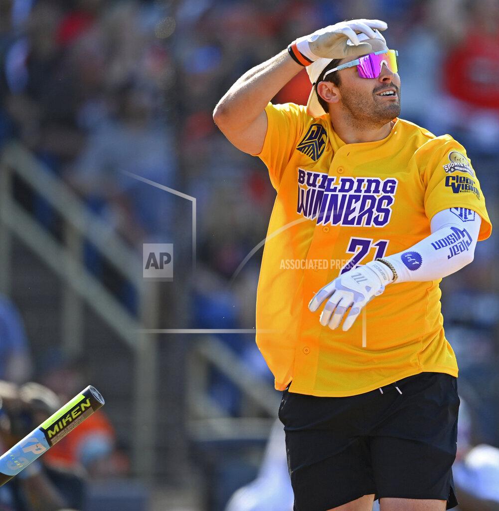 David Dermer Cleveland Browns quarterback Baker Mayfield flips his bat during the Jarvis Landry Celebrity Softball game Saturday, June 12, 2021, in Eastlake, Ohio. (AP Photo/David Dermer)