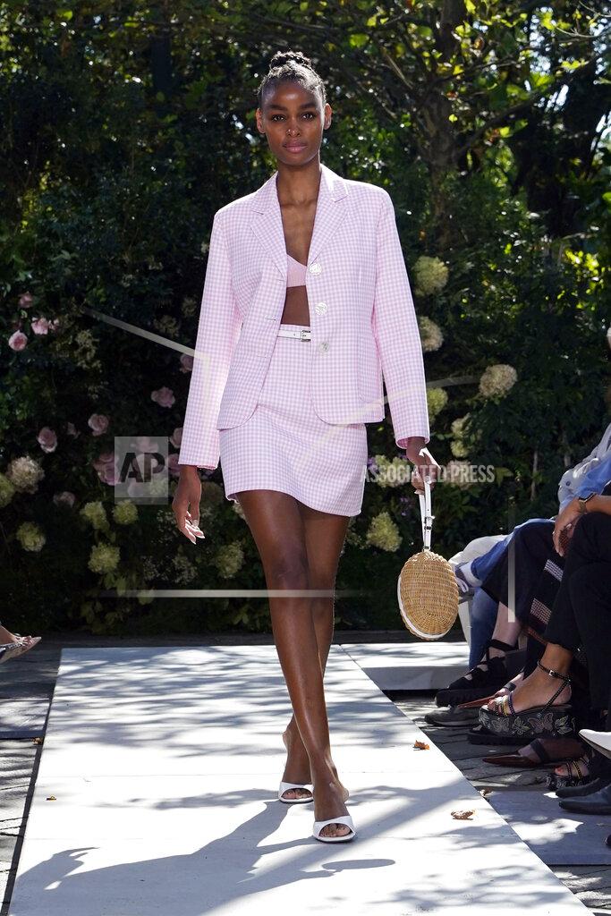 Richard Drew The Michael Kors Spring/Summer 2022 collection is modeled during Fashion Week, in New York, Friday, Sept. 10, 2021. (AP Photo/Richard Drew)